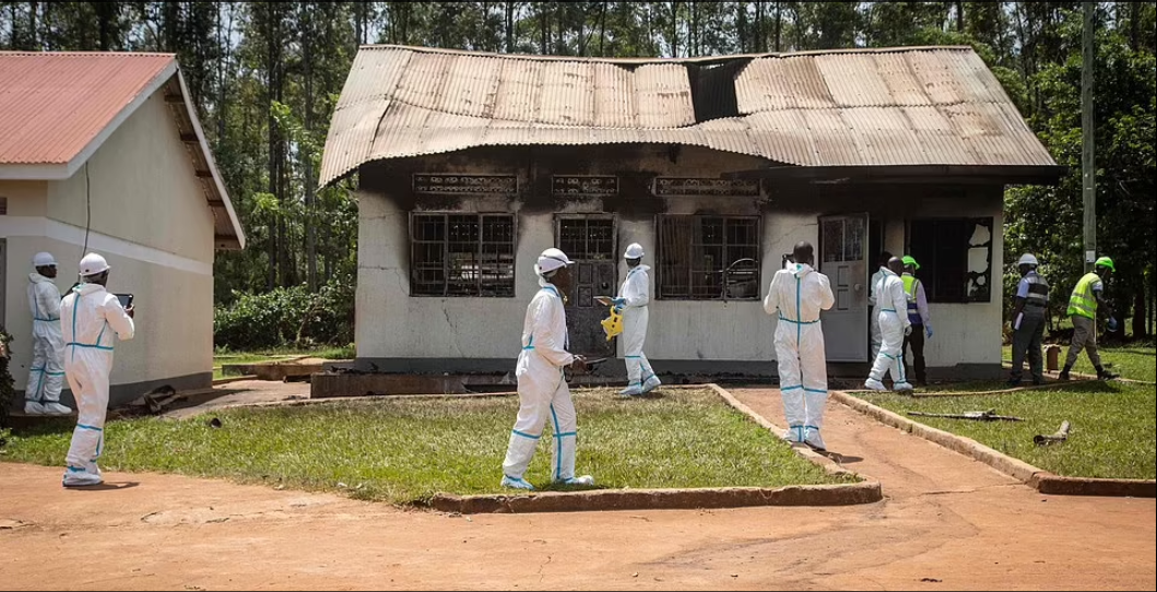 Forensic experts investigate the cause of the fire at Salama School of the Blind