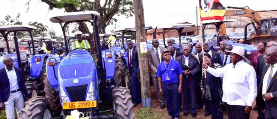 President Yoweri Museveni officially hands over  New Holland tractors at Namalere Agricultural Mechanisation Farm in Wakiso district recently
