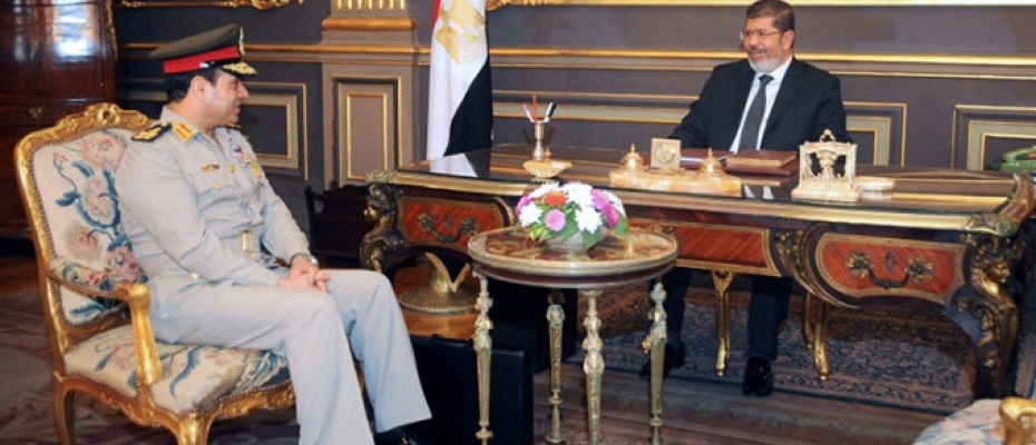 Egypt's then-president Mohamed Morsi meets then defence minister General Abdel Fattah al-Sissi -- the man who would ultimately topple him a year later 