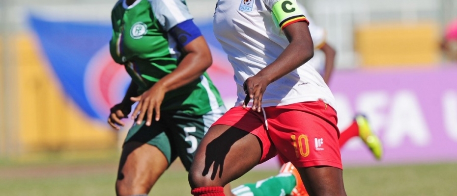 Uganda's Skipper Juliet Nalukenge aiming to shoot during the match. Courtesy photo