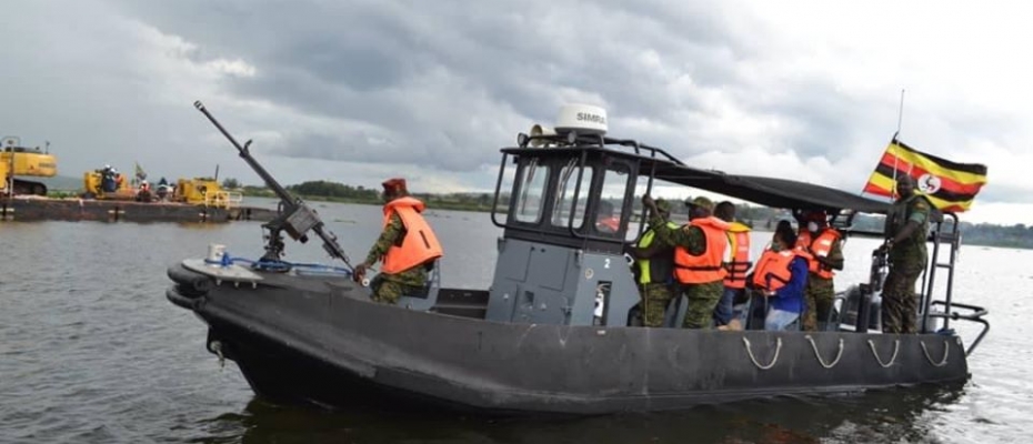 The team clearing Nalubale of the floating island. DPU photo