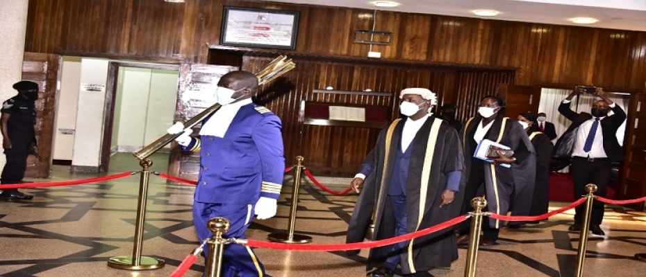 Deputy Speaker, Thomas Tayebwa makes his way to the Chamber led by the Sergeant at Arms