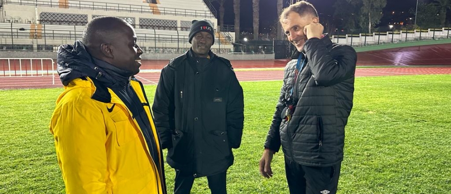 Sports minister Peter Ogwang (L) with the Uganda Cranes' coach Micho (R)