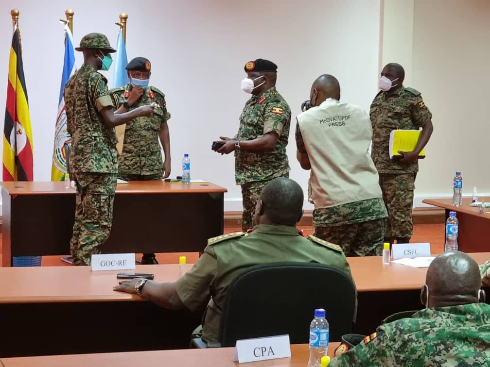Gen Kandiho Hands over Office to New CMI Boss Gen Birungi