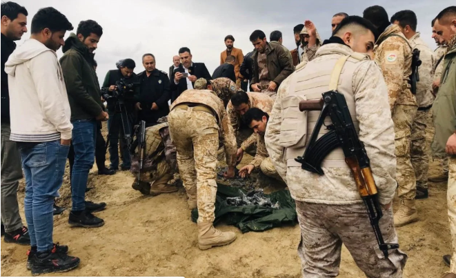  Iraqi security forces find and collect the pieces of missiles as they gather to inspect the site after Iran's Islamic Revolutionary Guard Corps (IRGC) targeted Ain al-Asad airbase in Iraq, a facility jointly operated by U.S. and Iraqi forces, at Bardarash district 