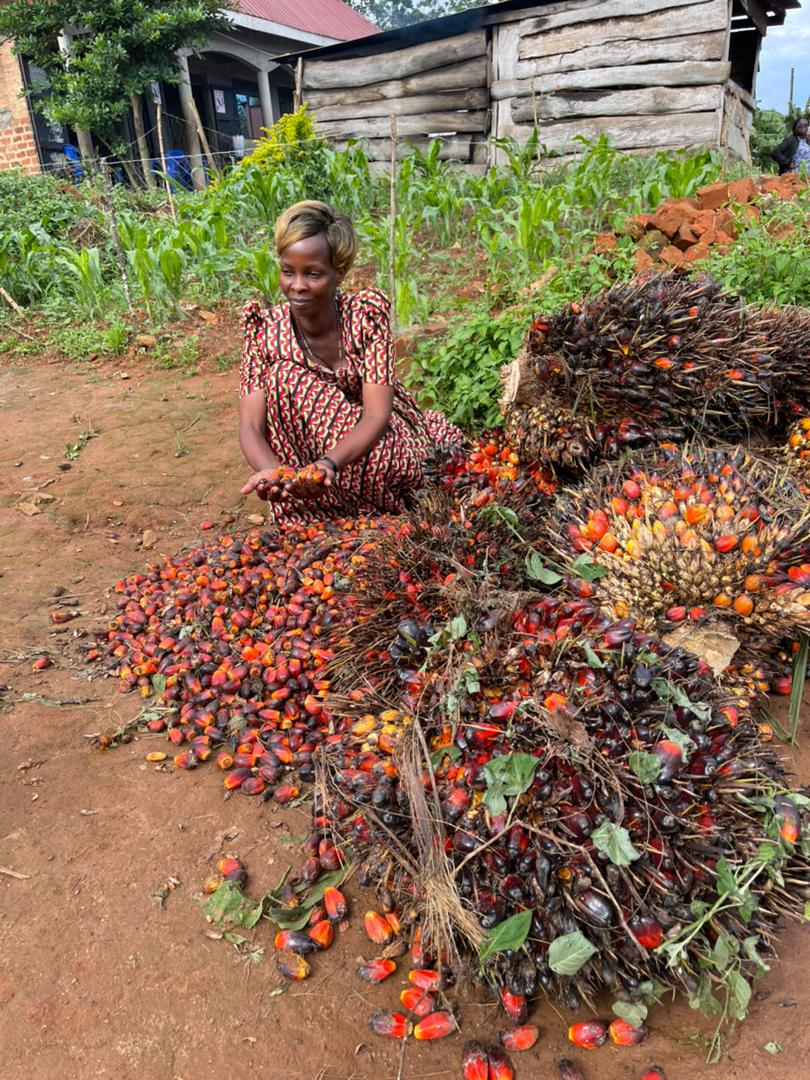 A farmer in Kalangala shows off her harvest