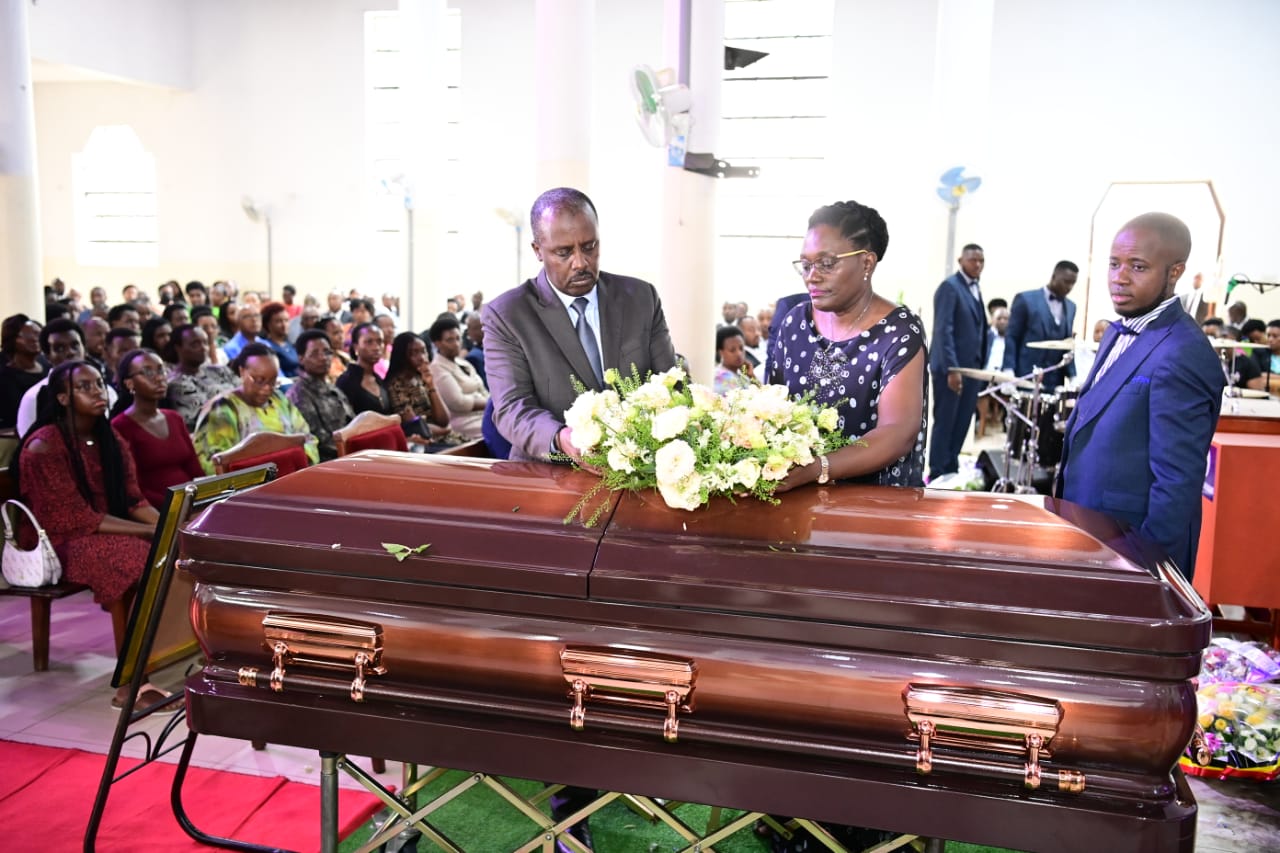 Gen David Muhoozi and his wife lay a wreath on the mother's casket