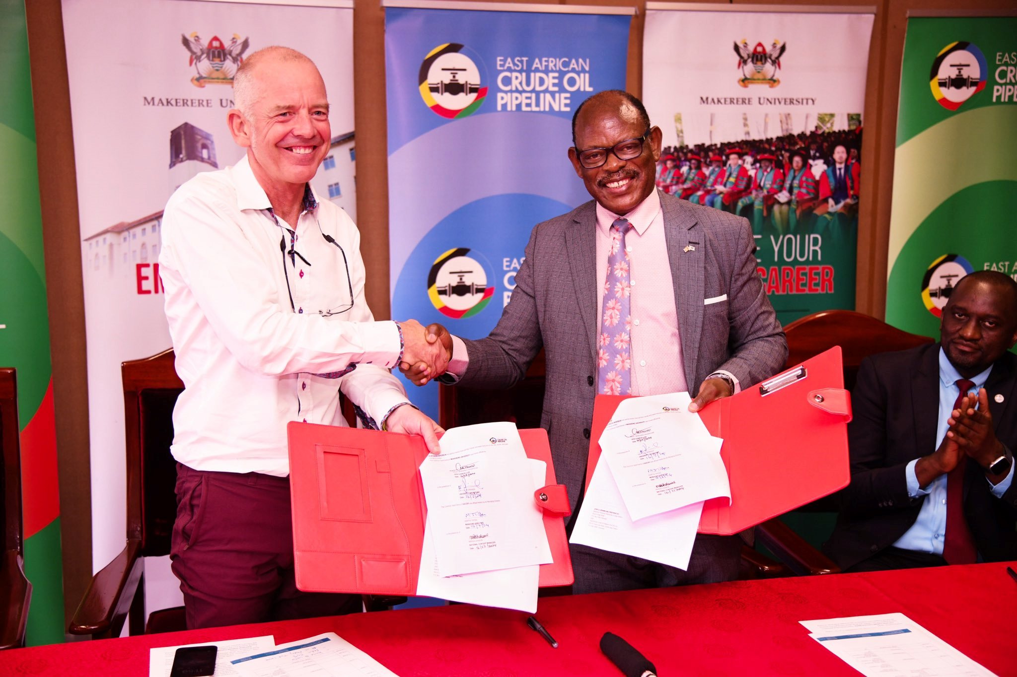 Prof. Barnabas Nawangwe (Right) and Martin Tiffen (Left) shake hands after the signing of the MoU on July 16.