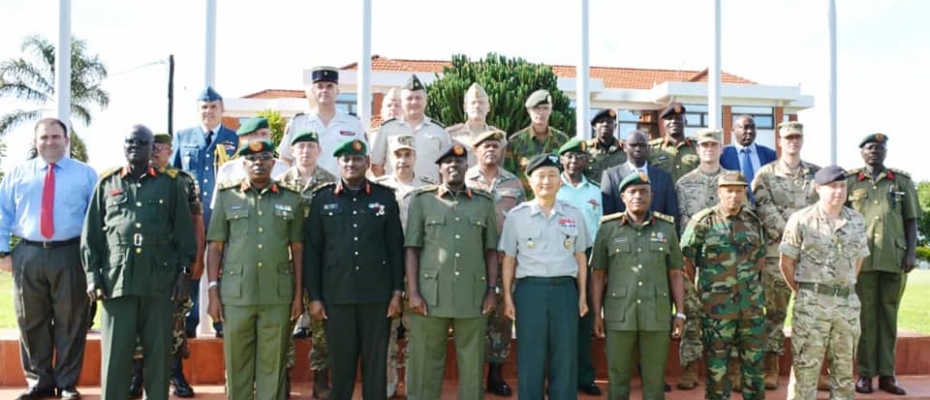CDF Gen.David Muhoozi (Middle) with Defence Attaches and other UPDF officers shortly after the meeting. DPU photo
