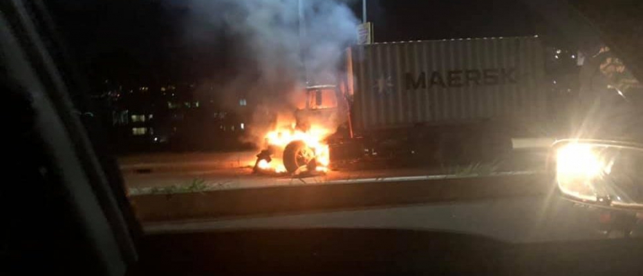Trailer up in flames at Kiira Road Police Station. Courtesy Photo