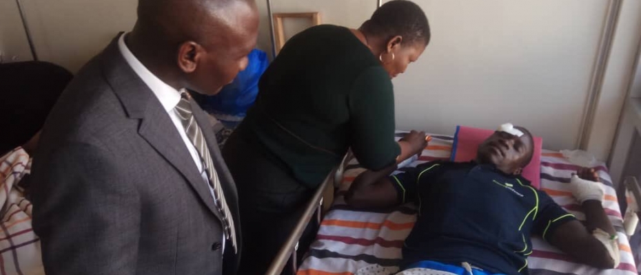 NRM SG Justine Kasule Lumumba checks on assaulted party supporter in hospital. Courtesy photo