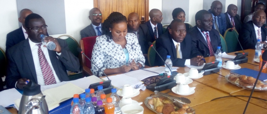 OPM PS Guwatudde (M) with her Undersecretary Joel Wanjala (L) appearing before PAC