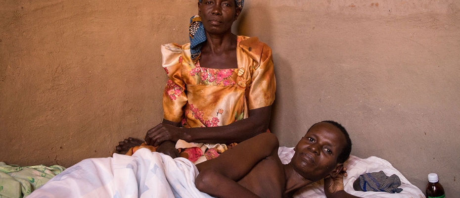 Abdorminal Cancer patient Harriet Namuwoya on her sickbed with the mother besides her at their home in Busoga. Courtesy photo 