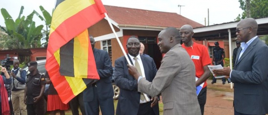 The 2019 Anti-corruption ambassador Robert Omito flagging off the caravan at Action Aid Uganda office in Kansanga. Courtesy photo
