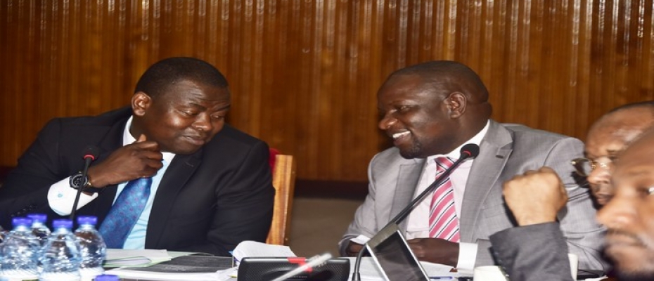 COSASE vice chairperson Hon Ibrahim Kasozi interacting with Hon Mwiru Paul during their meeting with UEDCL