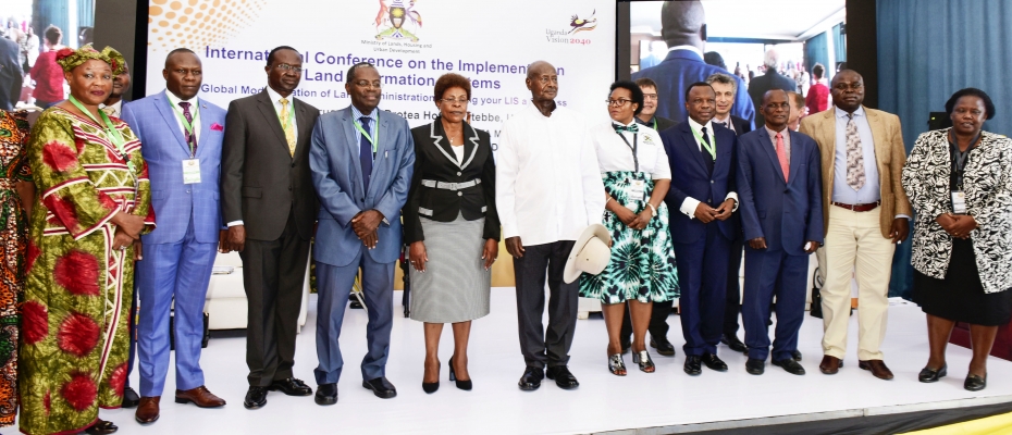 President Yoweri Museveni with Lands Minister Beti Kamya and other officials during the conference on Thursday. PPU photo