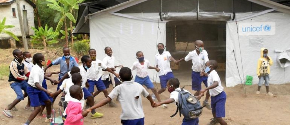 Pupils of Bulembia Primary School in Kasese District play during a break after attending classes in the newly installed high performance tent.