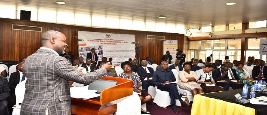 Tayebwa addresses participants at the dialogue on malaria