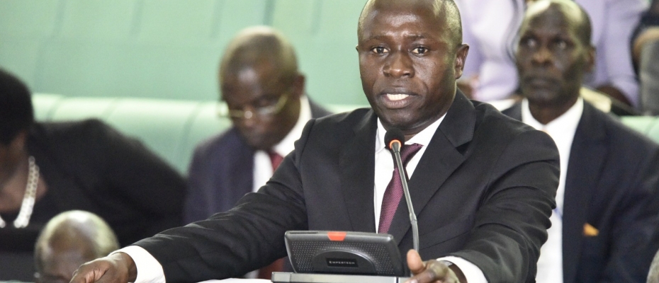 Sports Minister Peter Ogwang on the floor of Parliament