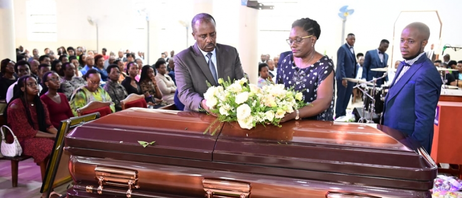 Gen David Muhoozi and his wife lay a wreath on the mother's casket