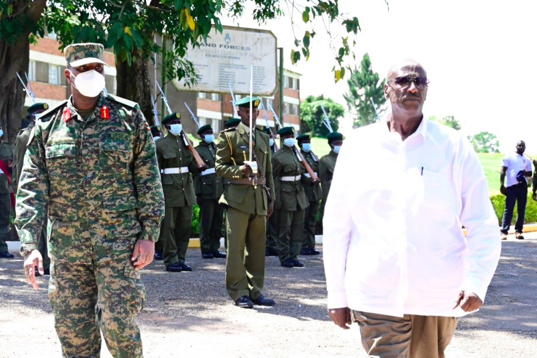 Gen Muhoozi Kainerugaba walks with Gen Salim Saleh