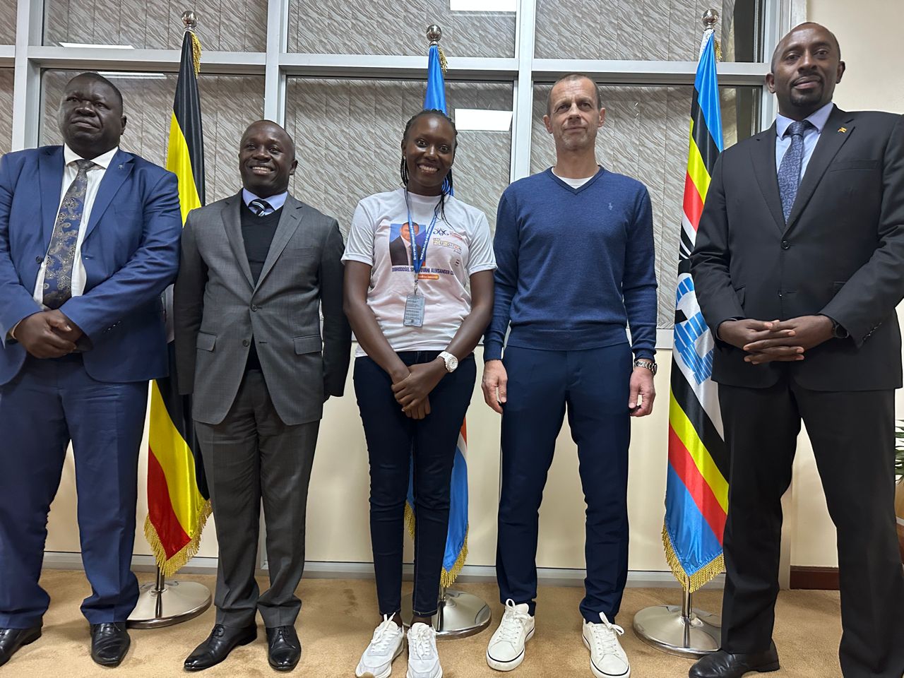 UEFA President Ceferin in a group photo with Minister Peter Ogwang and other officials